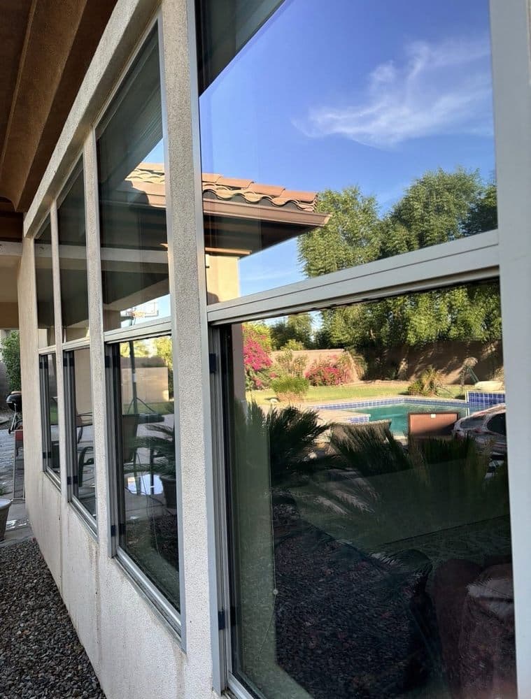 Technician cleaning exterior windows